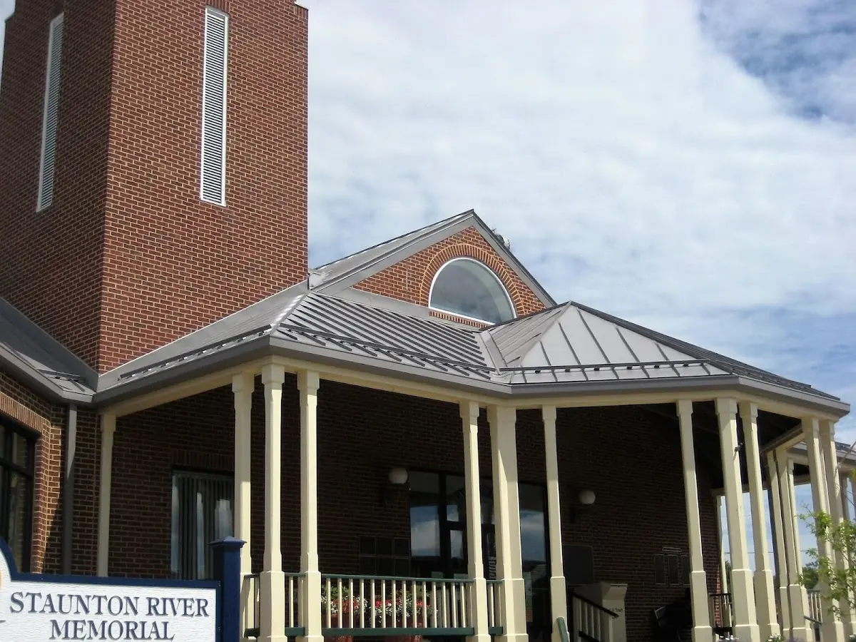 Skilled roofing craftsmen working on a residential roof in Sandtown-Winchester